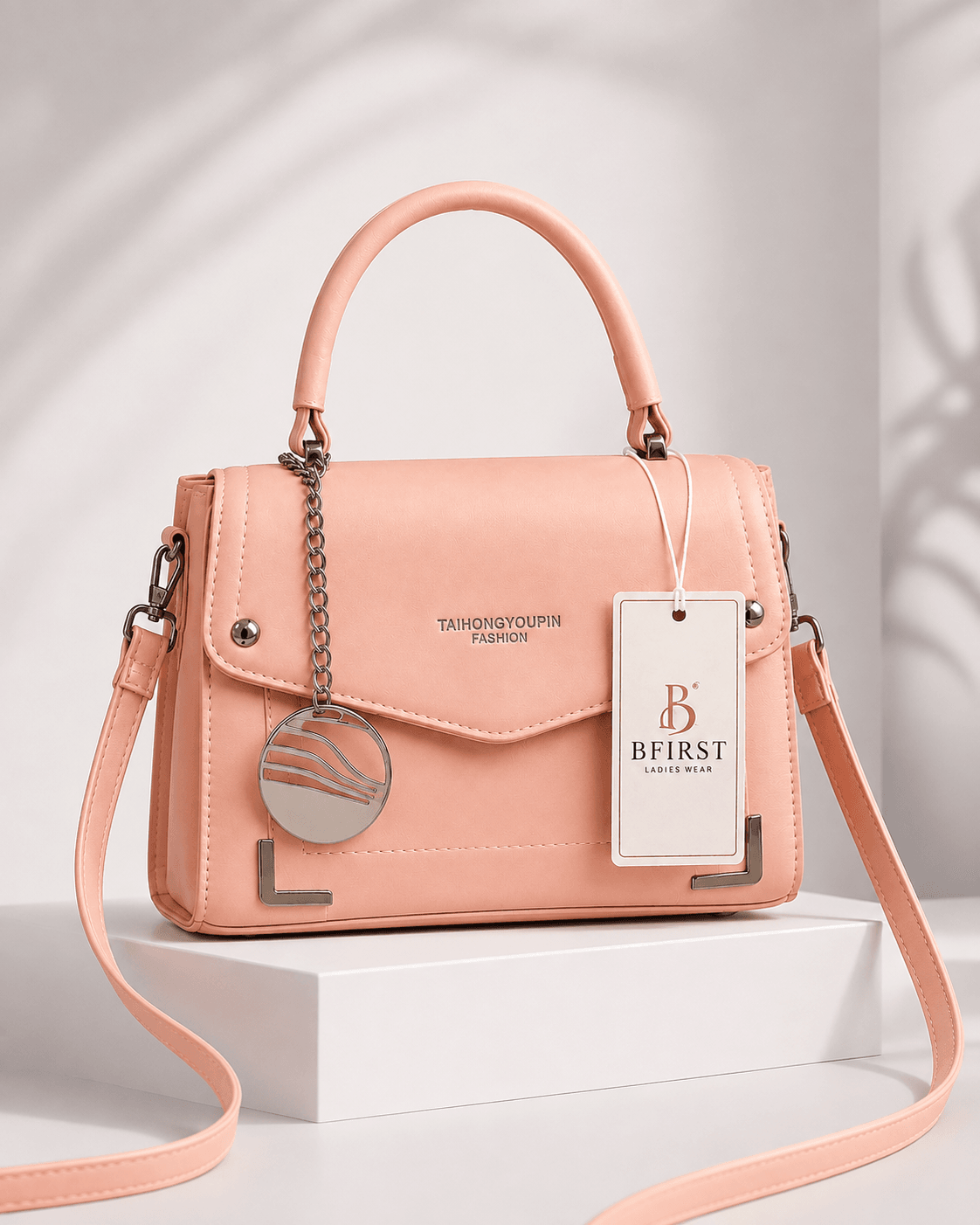 Disc Charm Flap Bag peach structured crossbody bag, front view